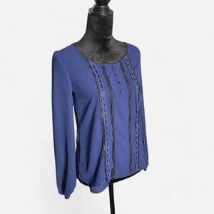 Candie’s blue blouse with black lace detailing